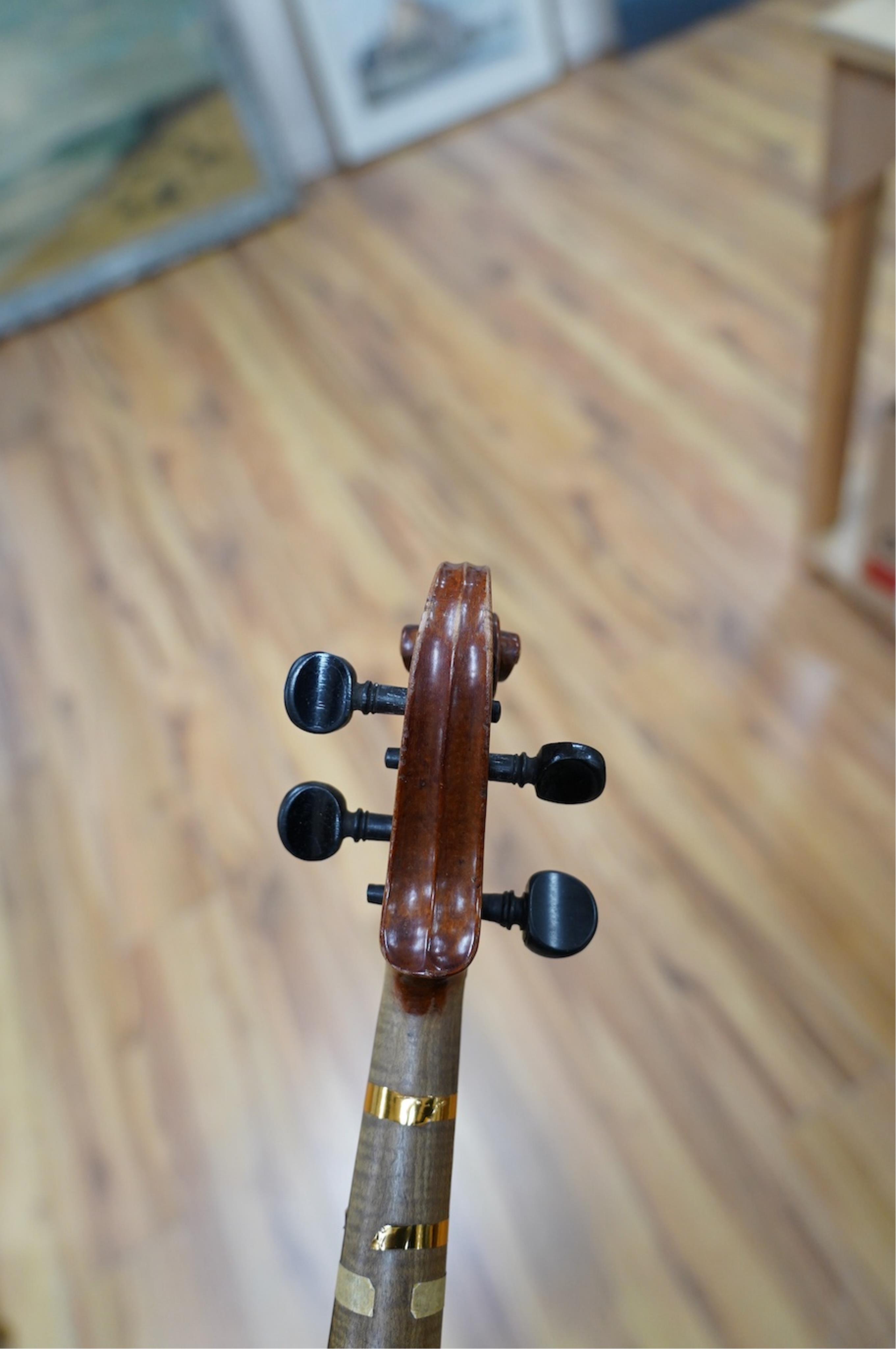 Two late 19th or early 20th century violins, one with case, back of largest measures 36cm. Condition - poor to fair